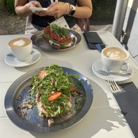 Breakfast — feta strawberry sourdough bread, and tomato ricotta pesto sourdough bread  at DAMKA • cafè & bakery in Krakow