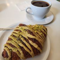 Pistachio croissant and batch brewed coffee (the croissant alone is perfection - buttery and soft on the inside, light and flaky on the outside) at DAMKA • cafè & bakery in Krakow