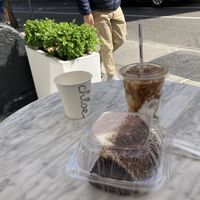 Chocolate espresso, cake, and vegan iced latte  at chloe in New York City