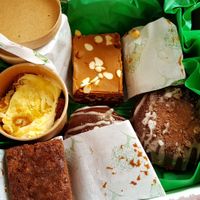 Carrot cakes, choc orange brownies, Biscoff rocky roads, and Bailey's cream filled donuts. at Teatime Collective in Manchester