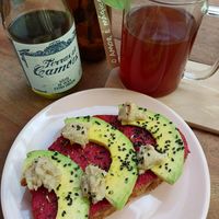 Toast de homus de beterraba, avocado, queijo de inhame e gergelim. at A Varandinha in Itacare