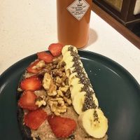 Almond butter toast with sunset press juice at iVegan Supershop Nha Trang - Healthy Plant Based Cafe in Nha Trang