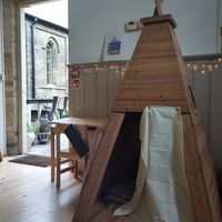 Kids area and door to outdoor seating at Old School Cafe in Bury St Edmunds