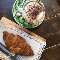 Croissant with a lot of blueberry jam and cappuccino with soy milk  at Biovegan Cafeteria Navarro in Valencia