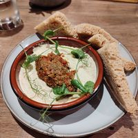 Hummus and olive tapenade with pomegranate glaze and rustic bread. No glaze or rustic bread 😞 at Four Crosses in Menai Bridge