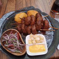 grilled mushrooms in savory sauce, peruvian corn and vegan mayo at Pachamama in Bremen