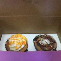 To-go cupcakes in pink boxes  at Get Caked Bakery in Rochester