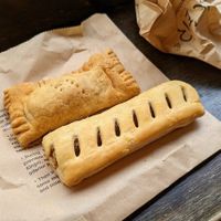 Vegan haggis roll to the left and vegan sausage roll to the right   at The Piemaker in Edinburgh