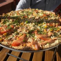 Impossible Chimi pizza. Impossible meat, cabbage, corn, and tomatoes topped with cilantro and chimi sauce, so delicious!  at Wahizza  in Ridgefield Park