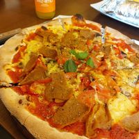 Vegan kebab pizza with paprika, fresh tomatoes and mushrooms at Express Pizza in Copenhagen