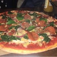 Pepperoni, spinach, sundries tomatoes and pineapple   at Express Pizza in Copenhagen