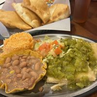 2 vegan tamales smothered in green chilis   at Posa's Tamale Factory & Restaurant in Santa Fe