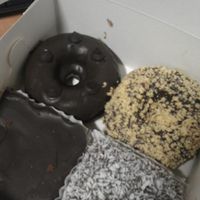 selection of vegan chocolate donuts and vegan tray bakes at Check Out My Buns in Belfast