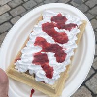 Vegan waffle with raspberry jam and vegan whipped creamm  at Vafleriet in Bergen