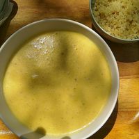 Sopa caliente de maiz, dhal de lentejas y leche de coco at Sopa - Boronat in Barcelona