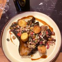 Eggplant with teriyaki sauce, assorted vegetables, various seeds, dairy-free lemon cream, and potatoes   at La Terrasse des Carmes in Saint-thome