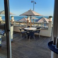 View of the terrace and the beach & sea beyond at The Reef in Sandown