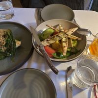 Left is the warm gem dish, right is a fab tomato and veg salad.  Unusual herbs used   at SHŌSH in New York City