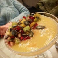 Coconut panacotta (vegan), with pear coulis, seasonal fruit, Thai basil at Slow in Paris