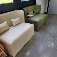 Sitting area outside the restrooms. at Just Falafel Vegan Cafe in Houston