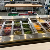 The obviously fresh and cleanly displayed foods used. at Just Falafel Vegan Cafe in Houston