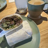Gyro burger with chai   at Just Falafel Vegan Cafe in Houston