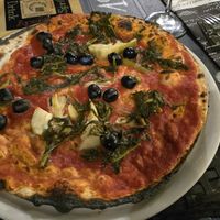 Vegano pizza...very thin. I didn't like the sauce, thickness or the veggies where were very "fiberish" at Grazie a Dio è venerdi in Rome