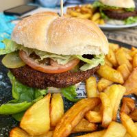 Vegan burger with falafel cutlet and fried potatoes. The hamburger was spicy but not bad! at Maus Food & Drinks in Oviedo