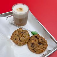 pistachio cookie & chocolate cookie, latte macchiato with oat milkk  at Milo's Cookies in Basel