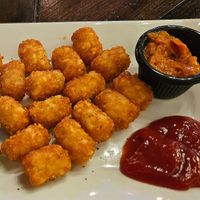 Vegan cheese burger with tater tots at Empire Square in Watertown