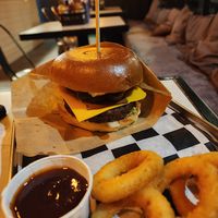 Spicy bacon vegan burger with onion rings + bbq sauce at Teddy's Burger N' Bar in Warsaw