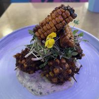 Sweet corn fritters on a bed of coconut and kaffir yoghurt, with corn ribs (lime and maple syrup coating)  at Kiss the Koala in North London