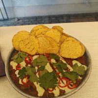 Chilli with beans, cilantro and nachos. at Queen Beans in Uppsala