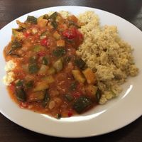 Vegan zucchini and tomato ratatouille type dish with millet at Szelence Cafe in Budapest