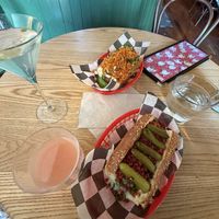 green curry martini and elote dog at the top, and guava martini and truffle glizz on the bottomm  at Tallboy in Oakland