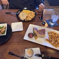 Above is country fried steak with tofu scramble and homestyle fries, fried green tomato appetizer to the left and the crunch wrap and seasoned fries on the rightt  at MoonShine in Cocoa