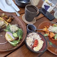 You’re seeing half a plate of avocado toast and tlayuda, an açaí bowl and a plate of chilaquiles   at Antigua Coffee & Bakery in San Jose Del Cabo