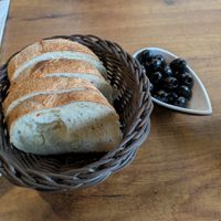 Complimentary bread and olives. at Ristorante Café Aroma in Berlin