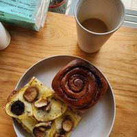 Cinnamon roll, Rusticana pizza (mushrooms, potato) and oatside coffee at Rya Bakehouse in Central Singapore