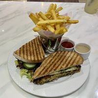Falafel aubergine sandwich with fries  at Mani's Cafe in Muscat