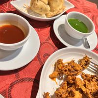 Huge portion of onion bhaji- made myself stop eating them so I would manage my main. I didn’t and took home a bit of both!  at Mother India in Kota Kinabalu