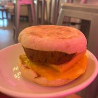 Vegan breakfast sandwich with large veg sausage  at Raining Berries USF - Açaí - Smoothie - Coffee in Temple Terrace