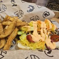 Vegan sausage Bahn mi w brew fries at ANC - 49th State Brewing - Ted Stevens Concourse C in Anchorage
