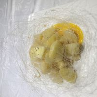 The exquisite, devine and far too filling Apple Deep Fried with Syrup.  Please do not attempt to eat this alone after a big meal! at Hetian Xinyu - Lotus Vegetarian in Dalian
