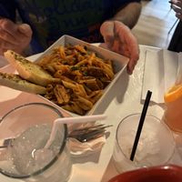 Penne pasta with sausage and garlic breadd  at The Modern Vegan in Royal Oak