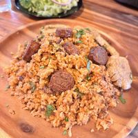 Locrio de longaniza - comes with side salad  at Next Stop Vegan - Greenpoint in Brooklyn