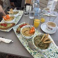 avocado toast, carrots with chickpea paste (like hummus) and bean paste with breadsticks. you also get one orange juice and one hot drink (we got cappucino with soy milk)  at Così Com'era in Alberobello