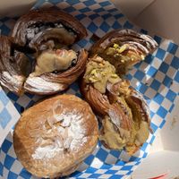 Almond croissant, cinnamon swirl, pistachio  at Okja in East London