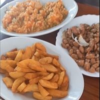 đuveđ, potato wedges and bean/onion salad  at Restoran Markat in Pula