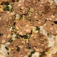 Pinsa with vegan mozzarella and vegan mortadella at Pinsieri di Antonio Pompei in Maglie